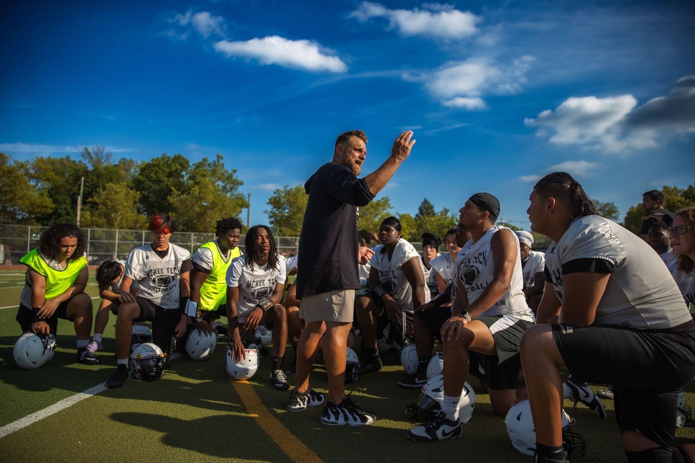 App addresses the team at practice