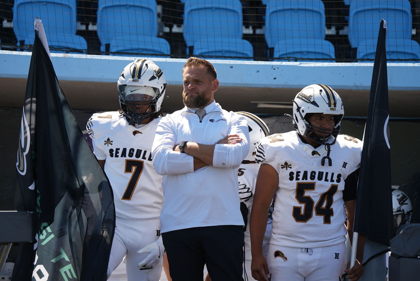 Chris App with two Seagulls players before a game